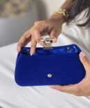 Close-up of Luxurious Navy Blue Velvet Clutch Texture